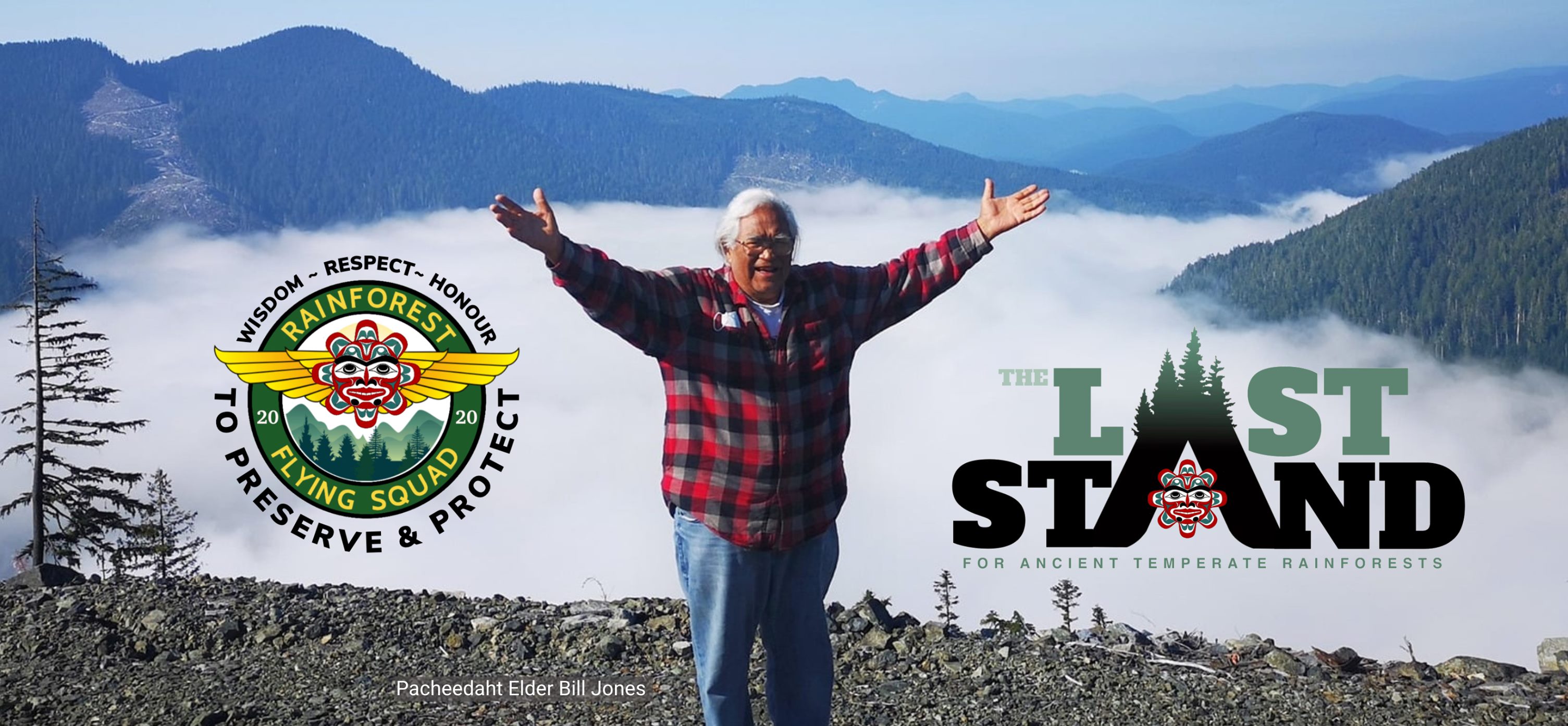 A photo of Pacheedaht Elder Bill Jones standing in front of a mountain valley with visible deforestation in the background.